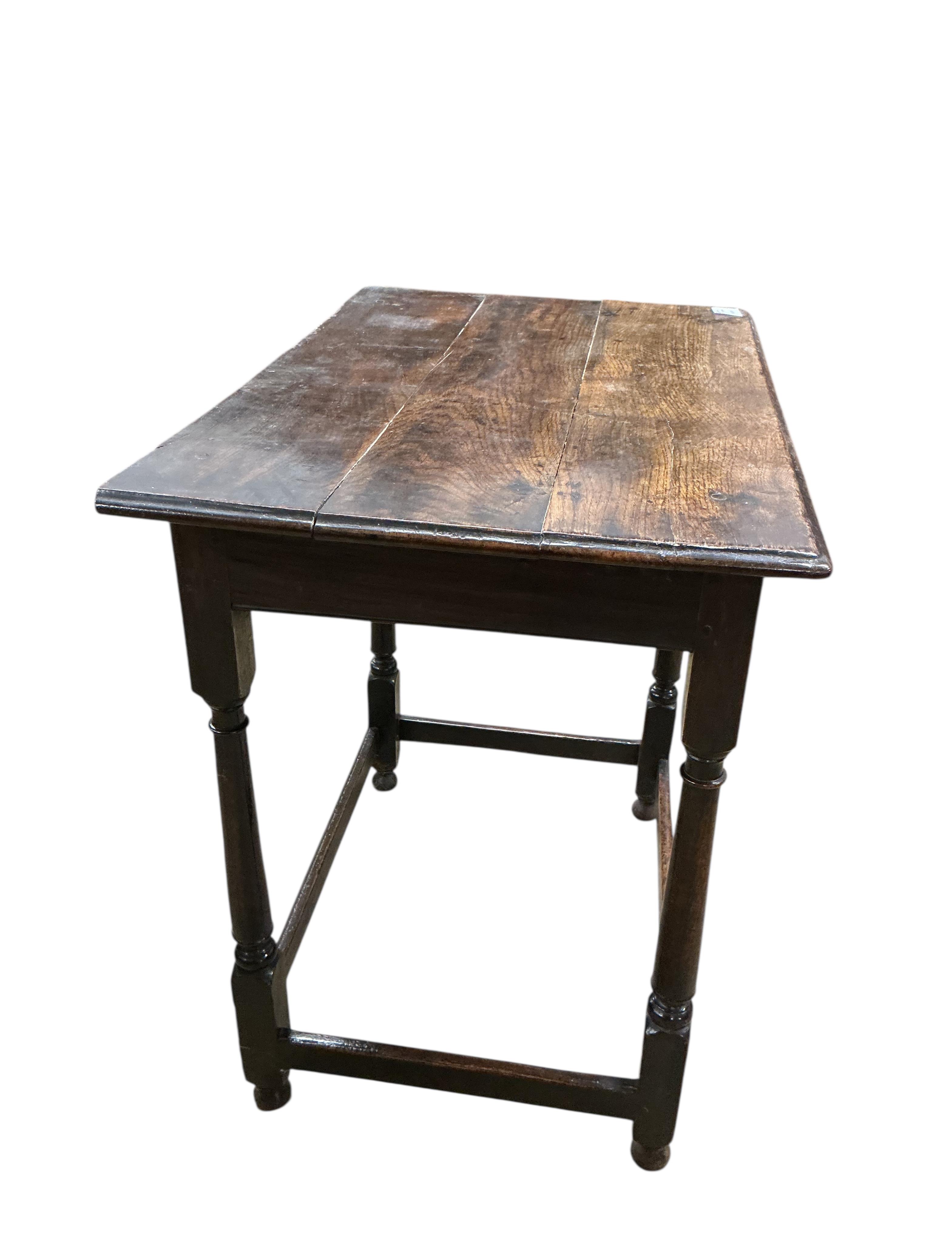 An early 18th century oak side table, fitted with a single long drawer, width 74cm, depth 49cm, height 74cm